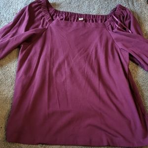 Three quarter length sleeve magenta shirt